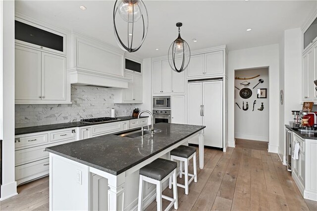 3630 Peachtree Rd NE Unit 3302, Atlanta, GA 30326 - kitchen with appliances with stainless steel finishes, premium range hood, decorative backsplash, and a warming drawer