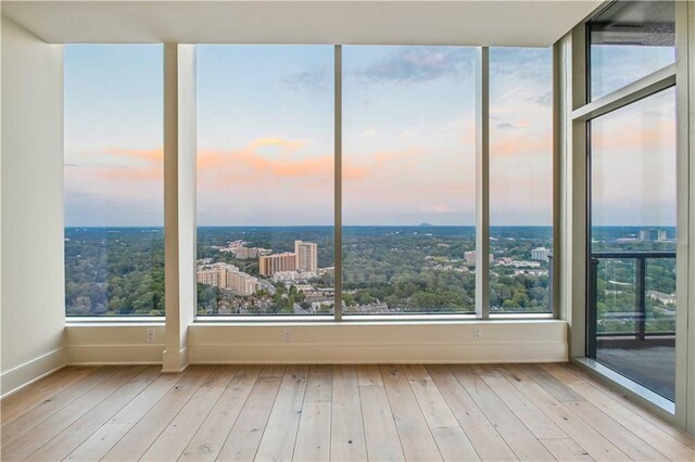 3630 Peachtree Rd NE Unit 3302, Atlanta, GA 30326 - interior space with a view of city, hardwood / wood-style flooring, and visible vents