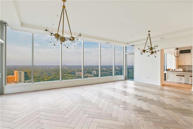 3630 Peachtree Rd NE Unit 3302, Atlanta, GA 30326 - interior space featuring an inviting chandelier, baseboards, and floor to ceiling windows