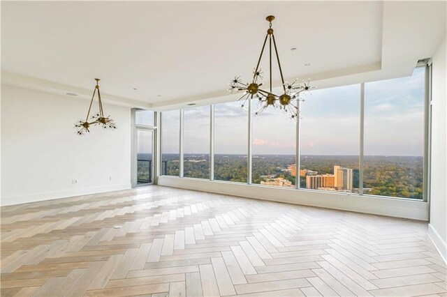 3630 Peachtree Rd NE Unit 3302, Atlanta, GA 30326 - unfurnished room with an inviting chandelier, baseboards, and visible vents