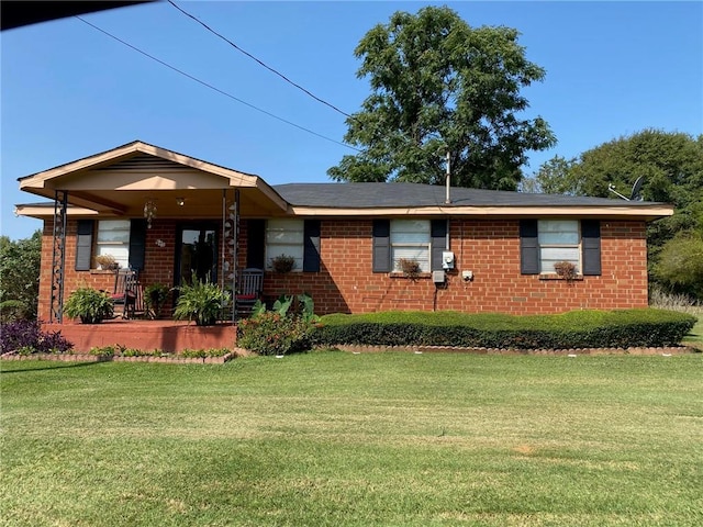 ranch-style house with a porch and a front lawn