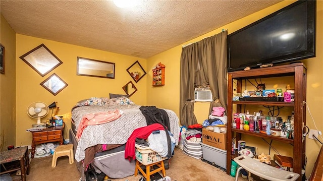 carpeted bedroom featuring a textured ceiling