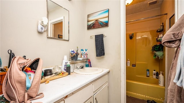 bathroom featuring vanity and bathing tub / shower combination