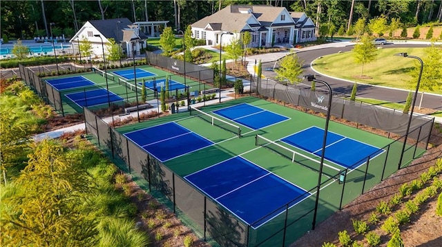 view of tennis court with fence