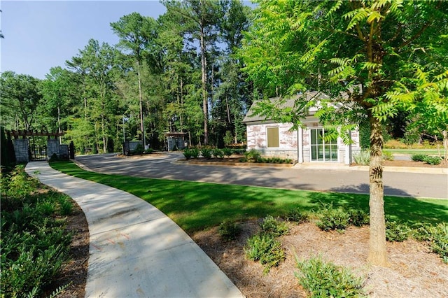 view of home's community featuring an outbuilding