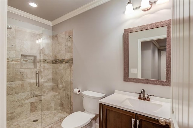 bathroom with toilet, vanity, ornamental molding, and a stall shower
