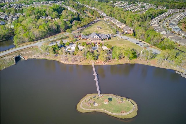 birds eye view of property with a water view and a residential view