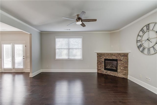unfurnished living room featuring a wealth of natural light, ceiling fan, visible vents, and wood finished floors
