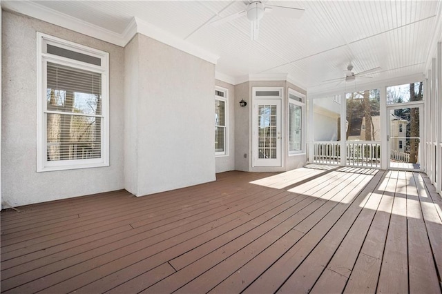 wooden deck featuring ceiling fan