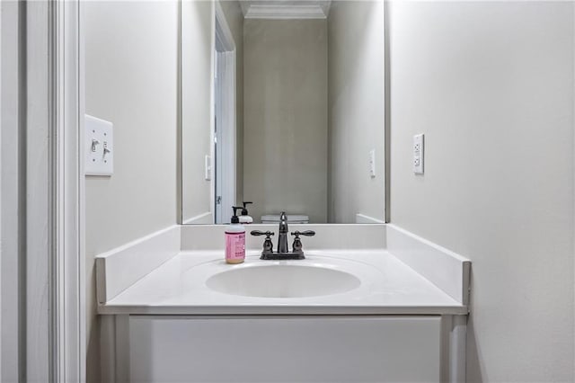 bathroom featuring vanity and crown molding