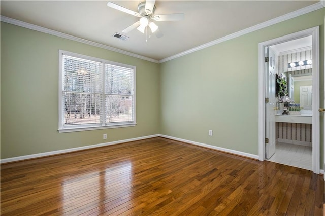 unfurnished bedroom with ensuite bathroom, ceiling fan, dark hardwood / wood-style flooring, and crown molding