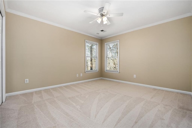 unfurnished room with light colored carpet, ceiling fan, and ornamental molding