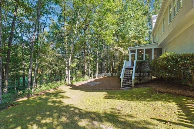 view of yard featuring a sunroom