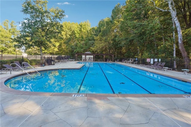 view of swimming pool featuring a patio