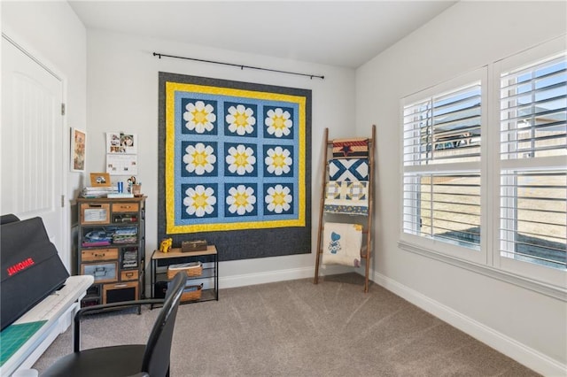 carpeted office with plenty of natural light and baseboards