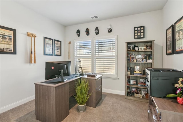 home office featuring visible vents, baseboards, and carpet