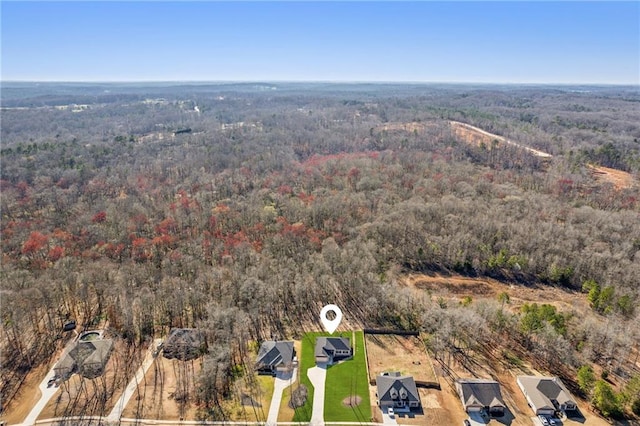 aerial view featuring a view of trees