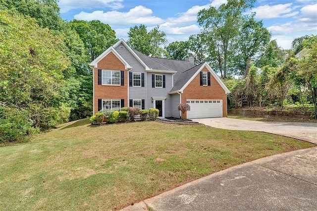 5705 Cannonero Dr, Alpharetta, GA 30005 - view of front of home featuring concrete driveway, brick siding, and a front lawn