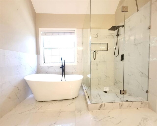 5705 Cannonero Dr, Alpharetta, GA 30005 - full bathroom featuring a marble finish shower, a freestanding tub, a wainscoted wall, and marble tiled flooring