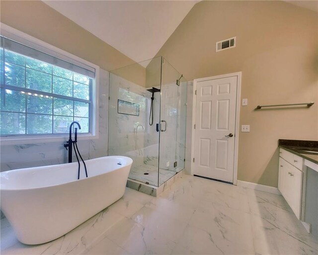 5705 Cannonero Dr, Alpharetta, GA 30005 - bathroom with a marble finish shower, a soaking tub, and vaulted ceiling