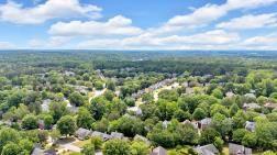5705 Cannonero Dr, Alpharetta, GA 30005 - full bath with a marble finish shower, a freestanding tub, vanity, vaulted ceiling, and marble finish flooring