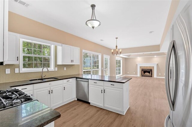 5705 Cannonero Dr, Alpharetta, GA 30005 - full bath with a marble finish shower, a freestanding tub, vanity, vaulted ceiling, and marble finish flooring