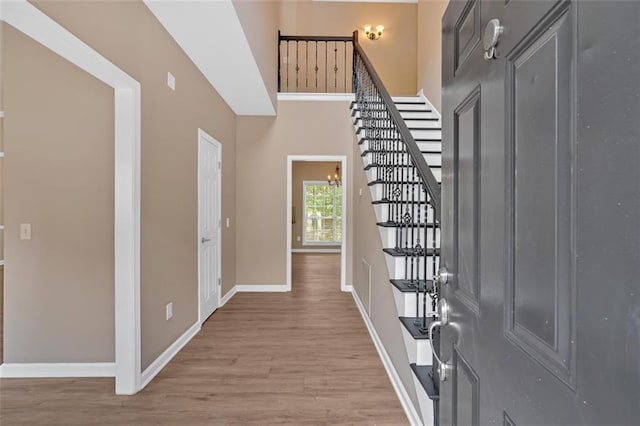5705 Cannonero Dr, Alpharetta, GA 30005 - unfurnished living room featuring a ceiling fan, a raised ceiling, wood finished floors, and recessed lighting