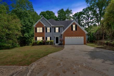 5705 Cannonero Dr, Alpharetta, GA 30005 - bathroom featuring marble finish floors, vanity, and bathing tub / shower combination