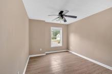 5705 Cannonero Dr, Alpharetta, GA 30005 - empty room with ceiling fan and wood finished floors