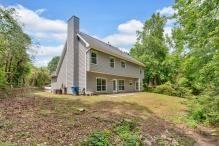 5705 Cannonero Dr, Alpharetta, GA 30005 - colonial inspired home with a chimney and concrete driveway