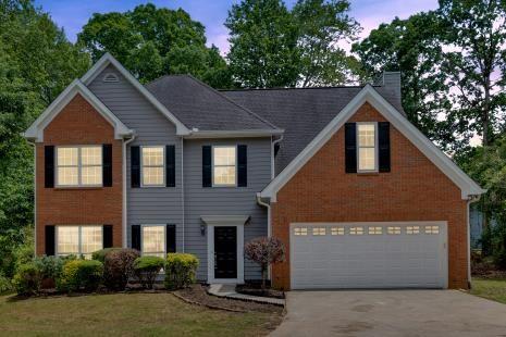 5705 Cannonero Dr, Alpharetta, GA 30005 - spare room featuring wood finished floors and a ceiling fan