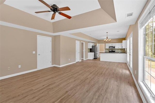5705 Cannonero Dr, Alpharetta, GA 30005 - full bathroom with marble look tile flooring, double vanity, vaulted ceiling, and a shower