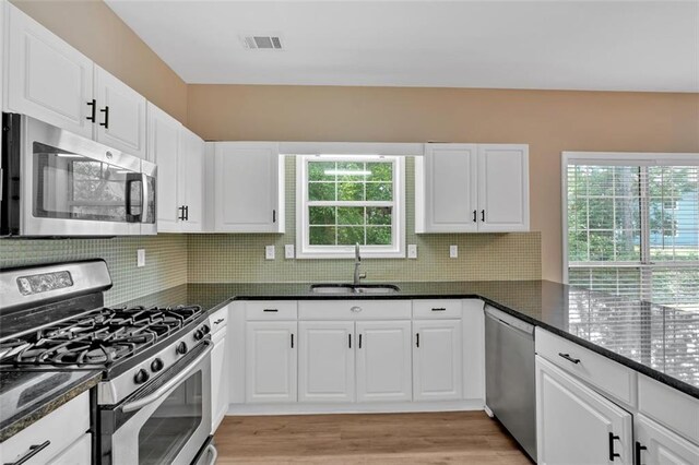 5705 Cannonero Dr, Alpharetta, GA 30005 - full bathroom featuring marble look tile flooring, a freestanding bath, a marble finish shower, and lofted ceiling