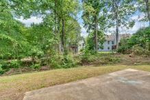 5705 Cannonero Dr, Alpharetta, GA 30005 - empty room with a raised ceiling, a ceiling fan, light wood-style flooring, and crown molding