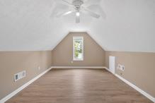 5705 Cannonero Dr, Alpharetta, GA 30005 - bathroom with marble look tile flooring and toilet