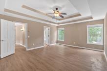 5705 Cannonero Dr, Alpharetta, GA 30005 - additional living space with a ceiling fan, wood finished floors, and lofted ceiling