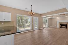 5705 Cannonero Dr, Alpharetta, GA 30005 - unfurnished room featuring a raised ceiling, wood finished floors, ceiling fan, and ornamental molding