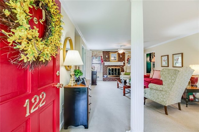 interior space with crown molding, a fireplace, and ceiling fan