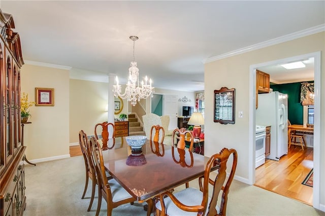 dining space with light carpet, ornamental molding, and a chandelier