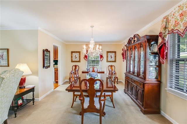 dining area with crown molding, a chandelier, and light carpet