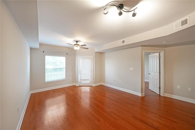 spare room with wood-type flooring and ceiling fan