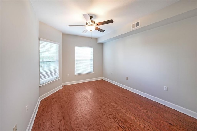 unfurnished room featuring ceiling fan and hardwood / wood-style flooring