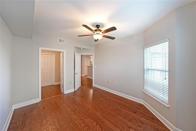 unfurnished bedroom featuring ceiling fan and hardwood / wood-style floors