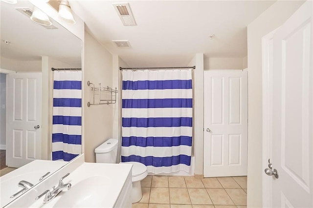 230 E Ponce De Leon Ave Unit 314, Decatur, GA 30030 - full bath featuring toilet, tile patterned flooring, a shower with curtain, and vanity
