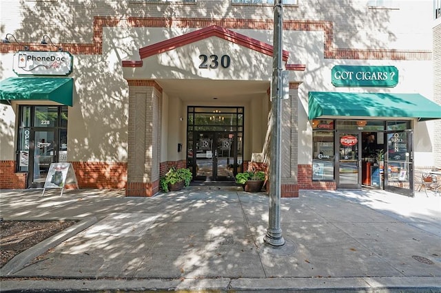 230 E Ponce De Leon Ave Unit 314, Decatur, GA 30030 - view of exterior entry featuring brick siding and french doors