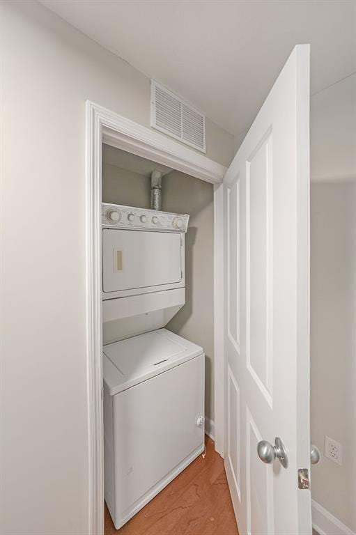 230 E Ponce De Leon Ave Unit 314, Decatur, GA 30030 - washroom with stacked washing machine and dryer and baseboards