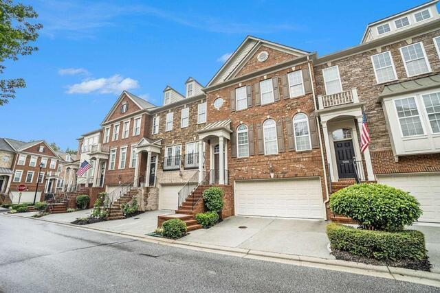 multi unit property featuring a garage