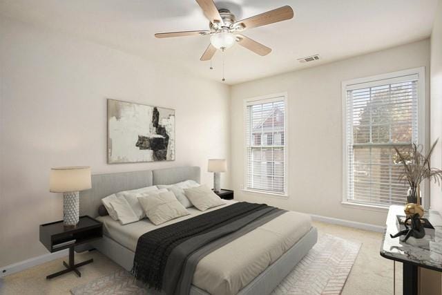 carpeted bedroom with ceiling fan