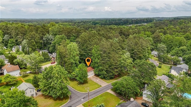 aerial view of residential area with a forest