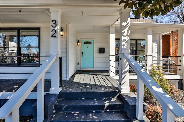 property entrance featuring covered porch